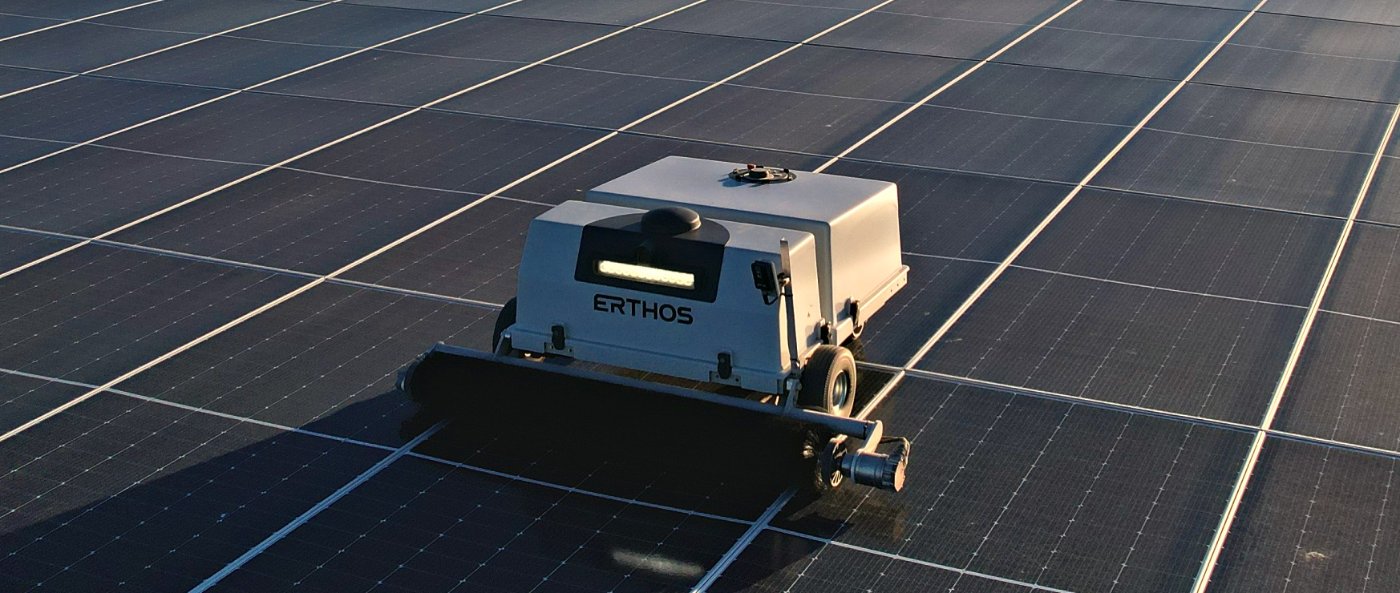 ErthBot autonomous cleaning robot on an operating Earth Mount Solar array